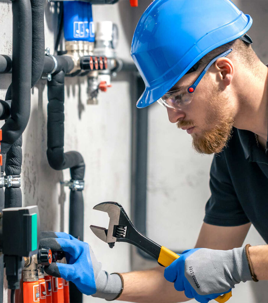 Holiday Heating servicing large commercial HVAC rooftop unit Provo