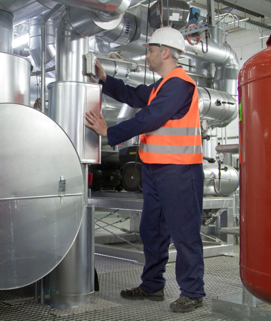Technician performing industrial boiler installation in Provo, UT.